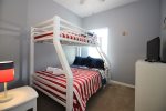 Twin over double bunk bed room with TV